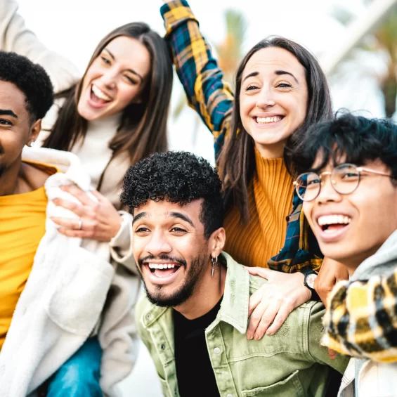 multicultural-students-cheering-at-travel-location-2022-02-09-18-49-18-utc